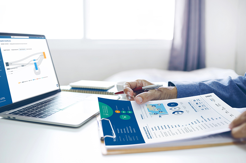 Asian,Businessman,Reviewing,Document,Reports,At,Office,Workplace,With,Computer
